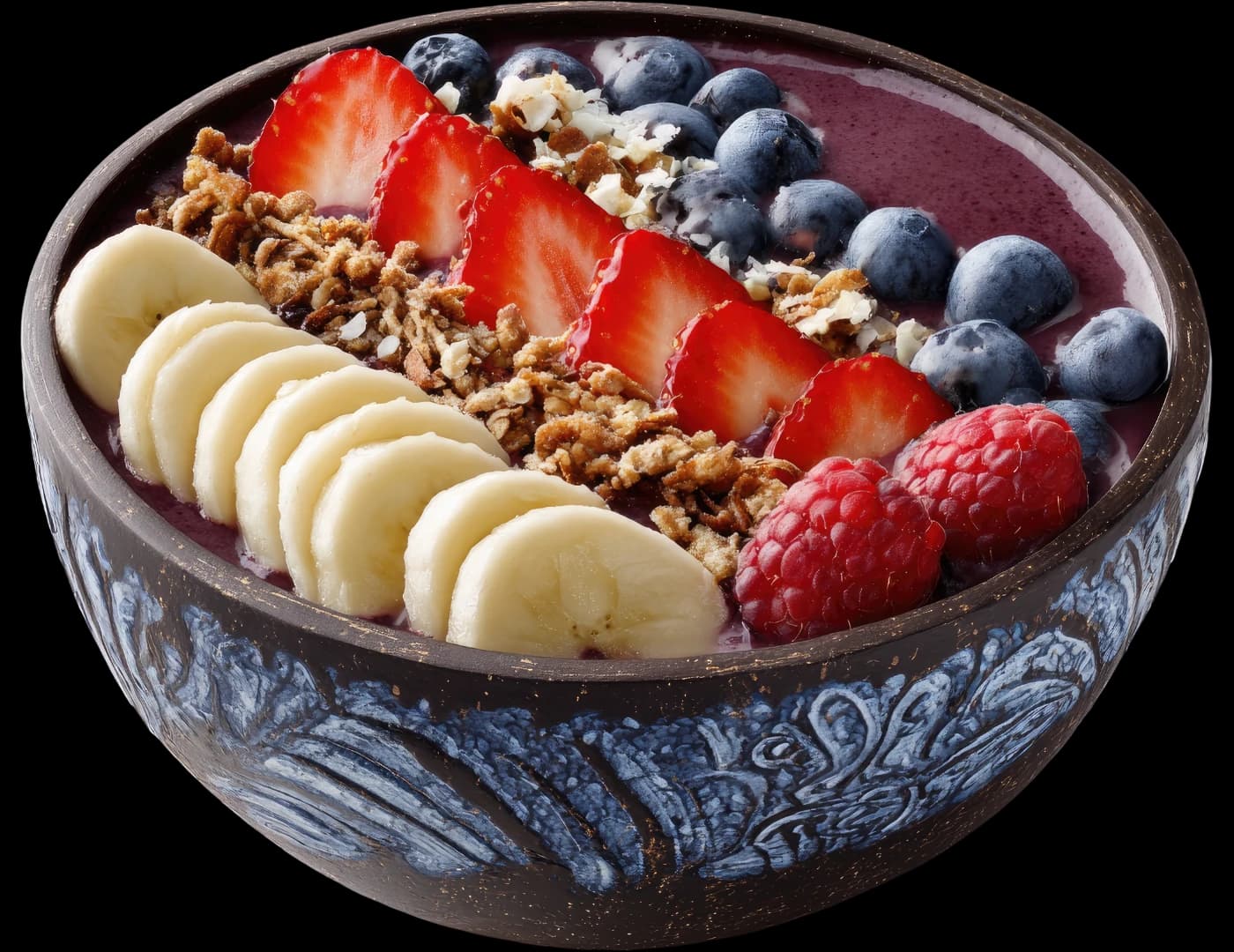 A smoothie bowl topped with banana, granola, strawberries and blueberries