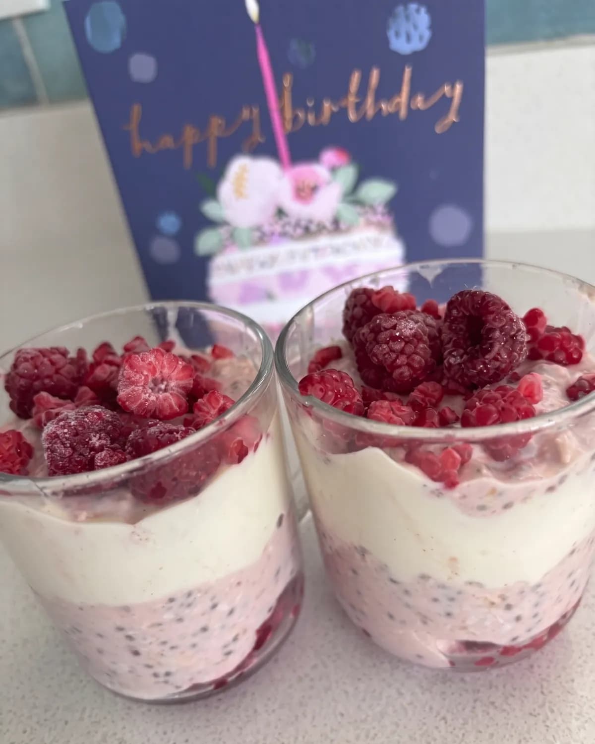 Two glasses of berry yoghurt parfait