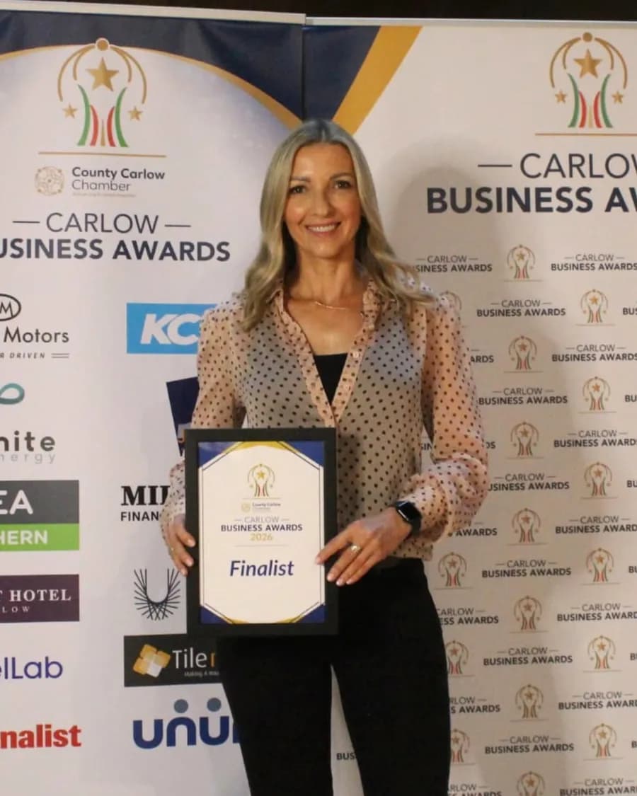 Klara Kisznyer holding her Carlow Business Awards 2026 finalist certificate